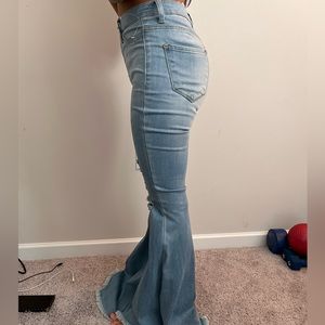 extra flare ripped light wash jeans
